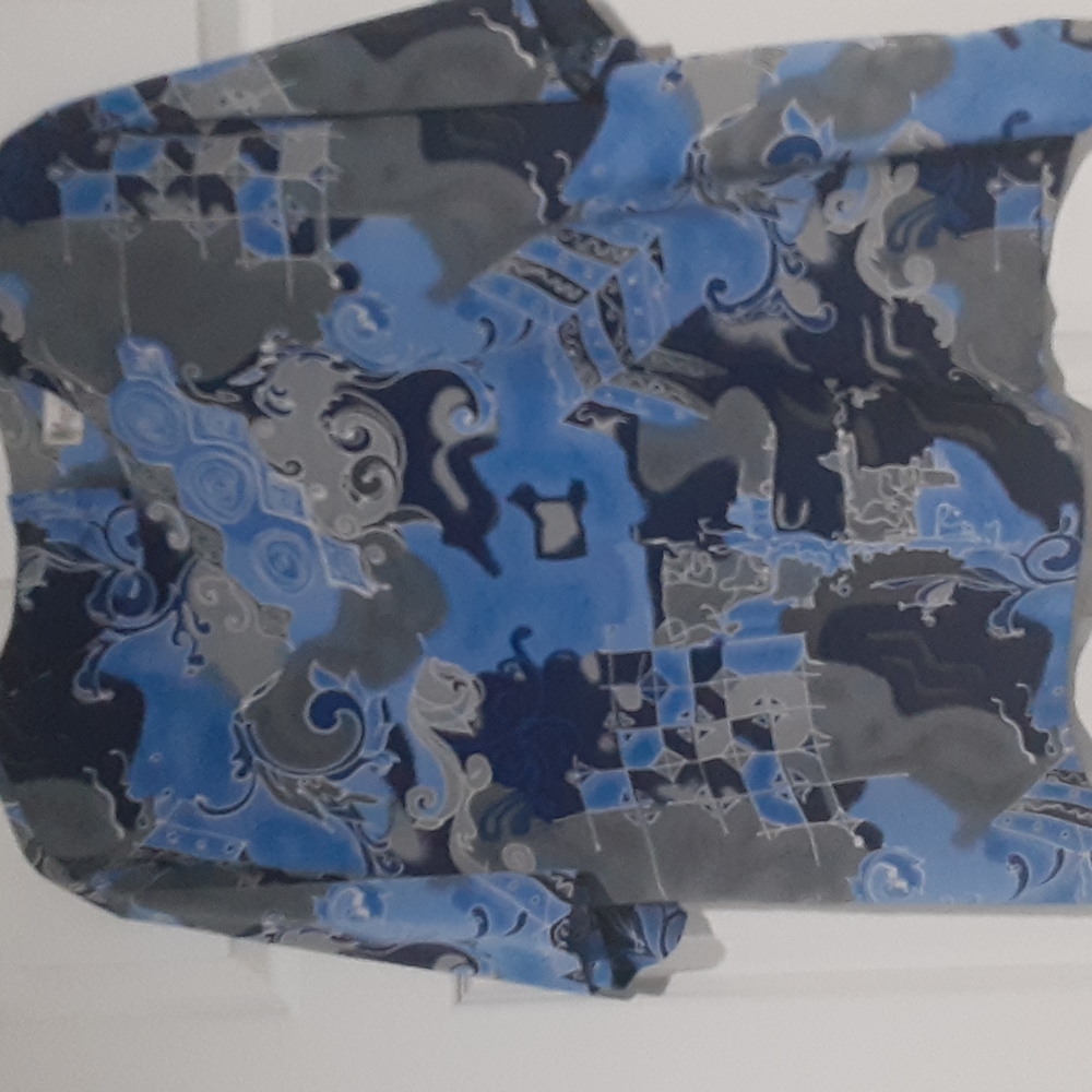 24 size blue print blouse. Button at back of neck. Print is blue, silver, grey